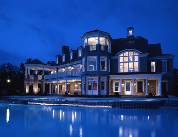 a front view of a building with a swimming pool