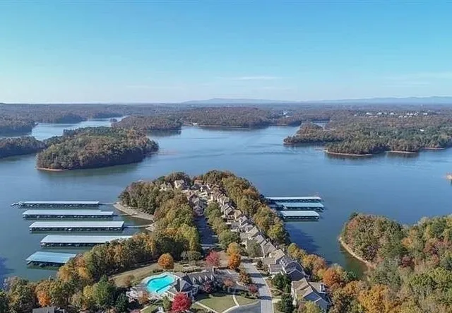 an aerial view of a house with a lake view
