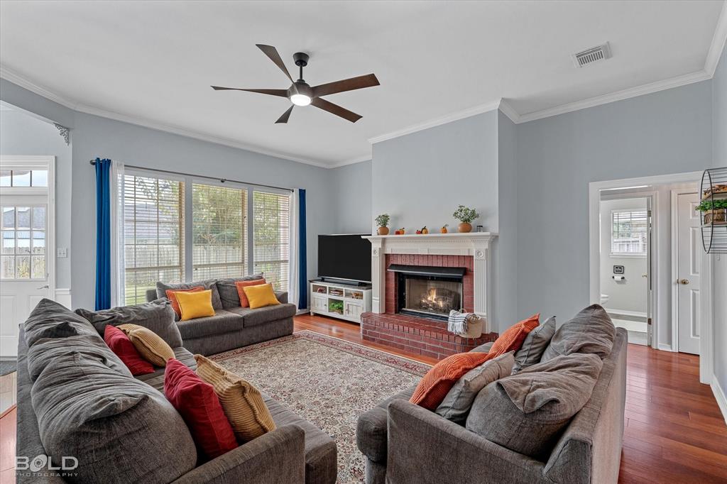 6020 Applegate Circle Bossier City, LA 71111 - Photo 14 of 36 a living room with furniture and a fireplace