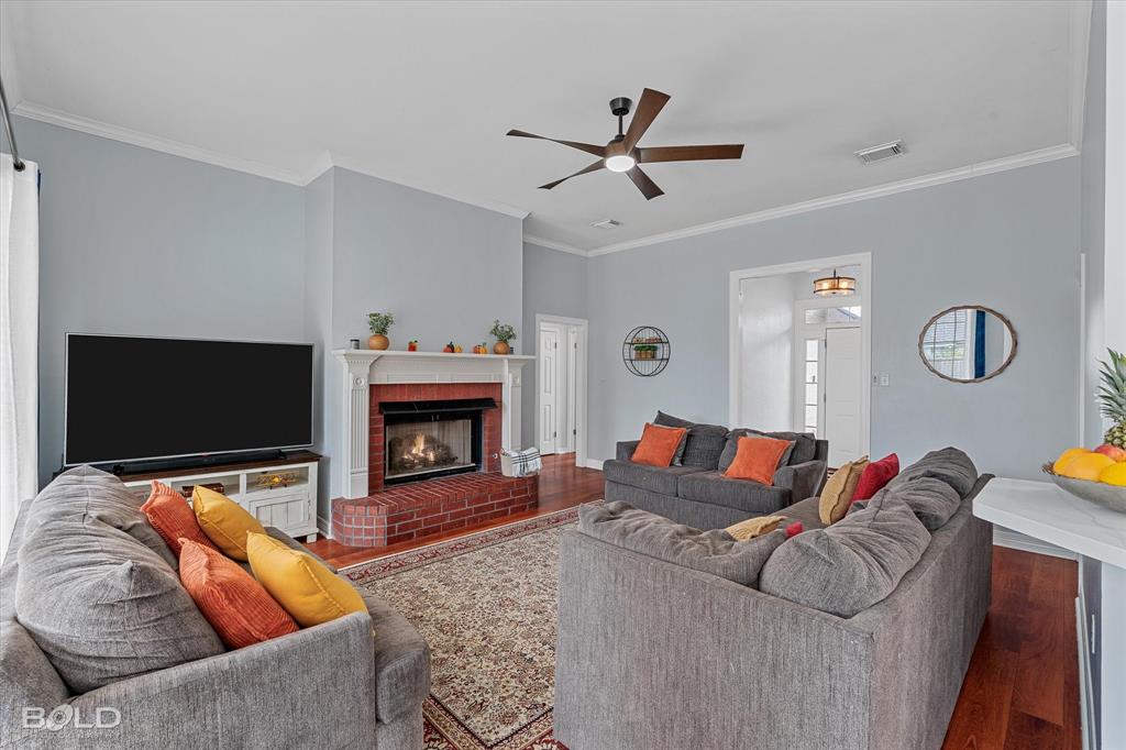 6020 Applegate Circle Bossier City, LA 71111 - Photo 18 of 36 a living room with furniture and a fireplace