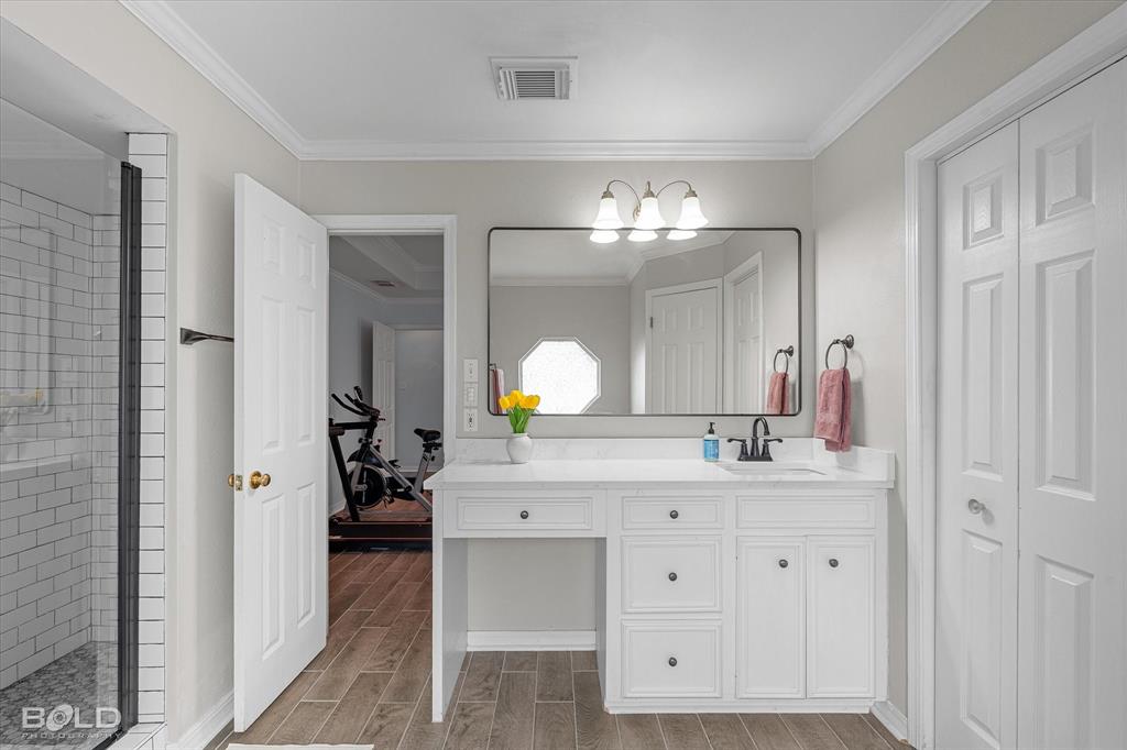 6020 Applegate Circle Bossier City, LA 71111 - Photo 29 of 36 a spacious bathroom with a double vanity sink and a mirror