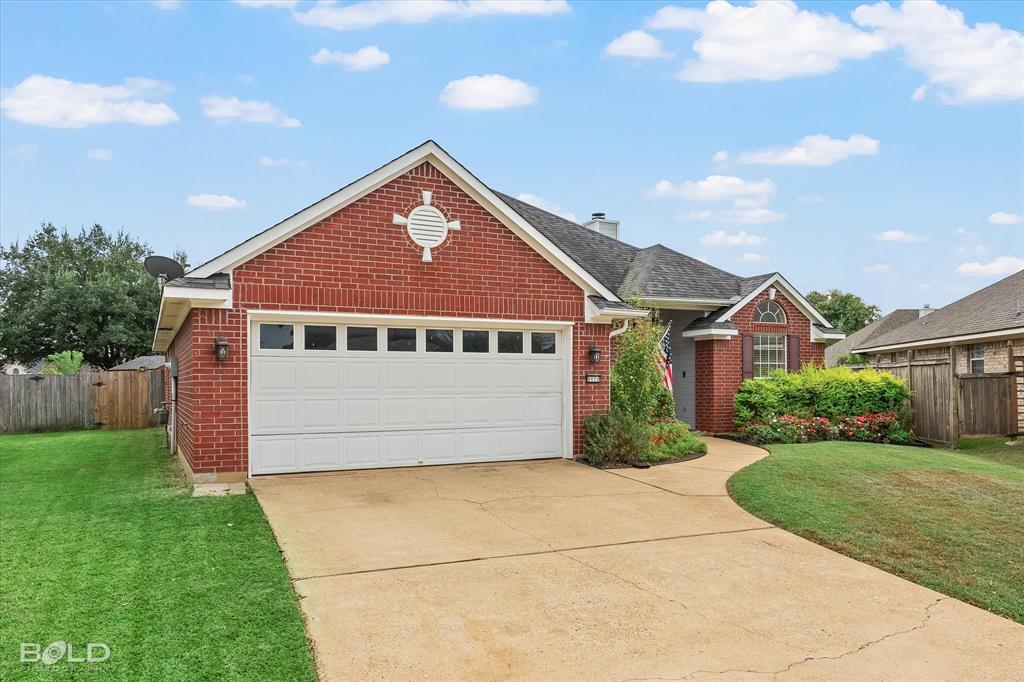 6020 Applegate Circle Bossier City, LA 71111 - Photo 4 of 36 a front view of a house with garden