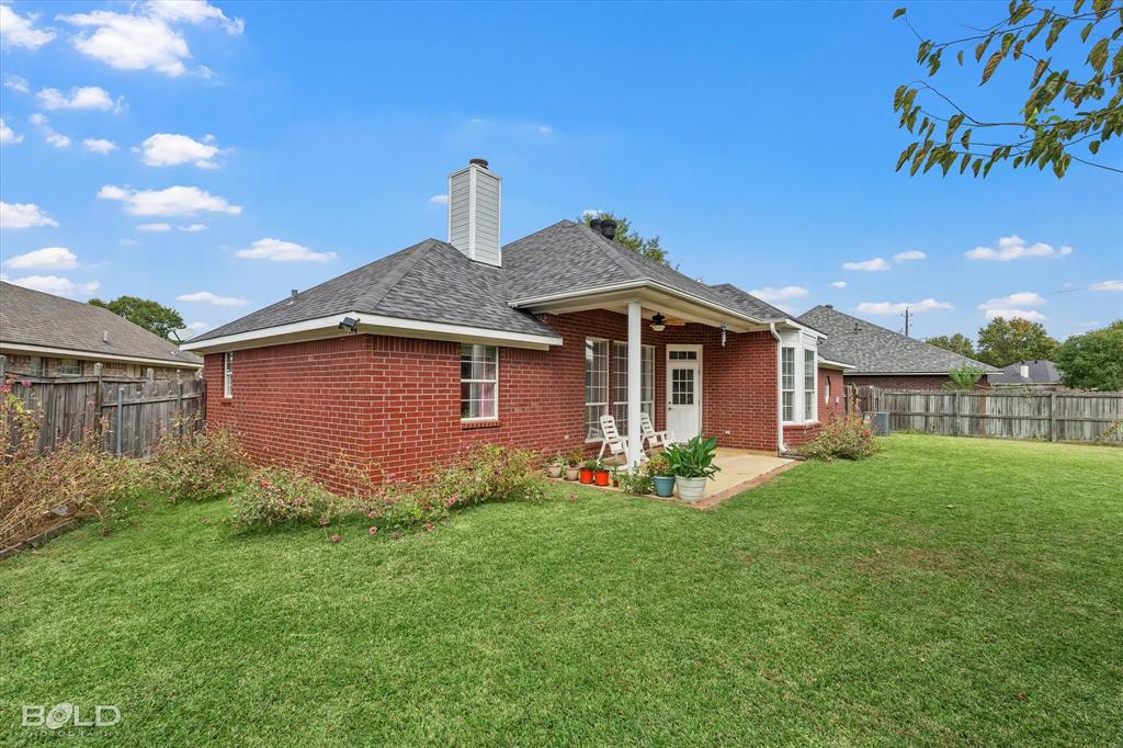 6020 Applegate Circle Bossier City, LA 71111 - Photo 6 of 36 a front view of a house with a yard