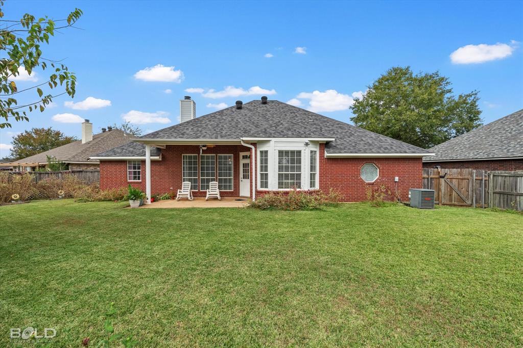 6020 Applegate Circle Bossier City, LA 71111 - Photo 8 of 36 a front view of a house with a garden