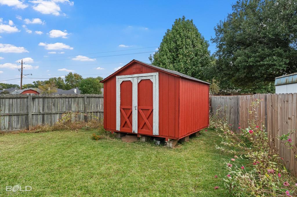 6020 Applegate Circle Bossier City, LA 71111 - Photo 10 of 36 a view of a small barn with a small yard