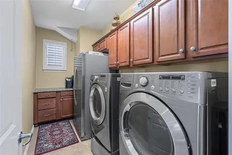 a view of a kitchen with washer and dryer