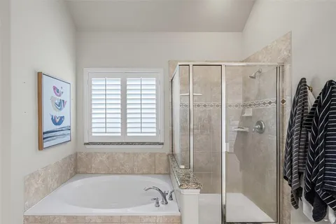 a bath tub sitting next to a window