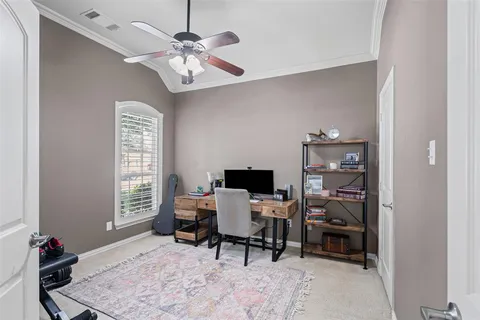 a workspace with furniture and a window