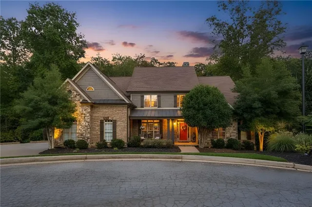 a aerial view of a house with a yard and garage