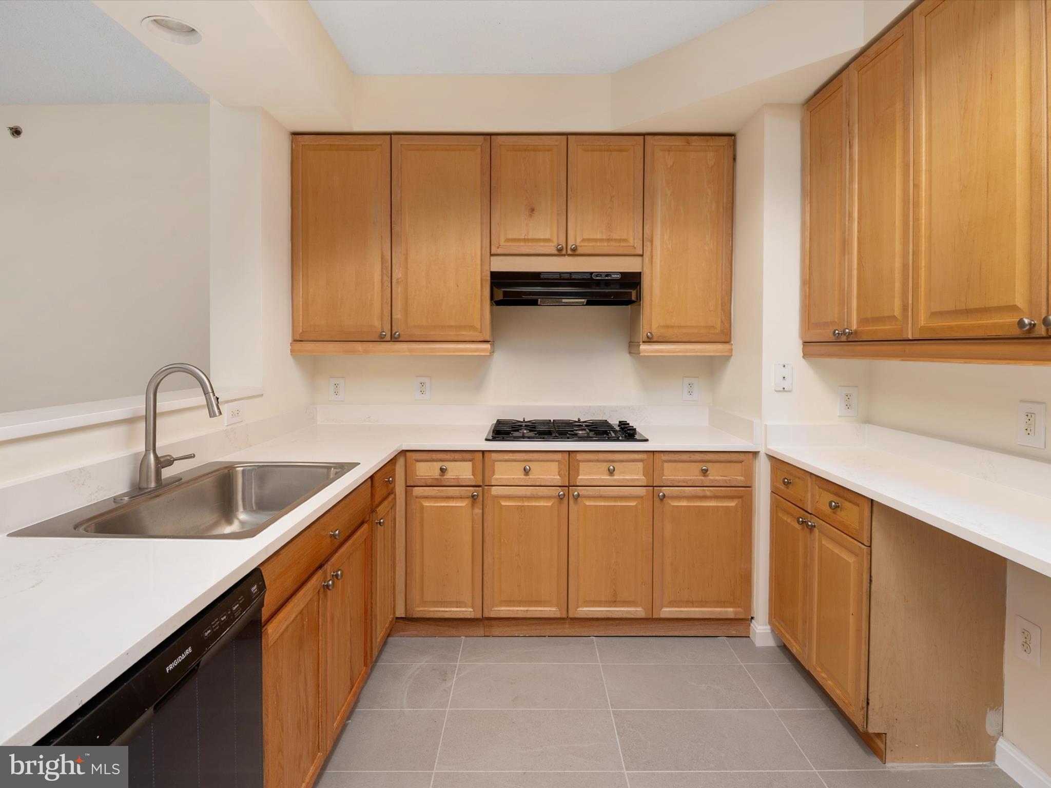 940 Astern Way, Unit 604 Annapolis, MD 21401 - Photo 13 of 27 a kitchen with granite countertop a sink and cabinets