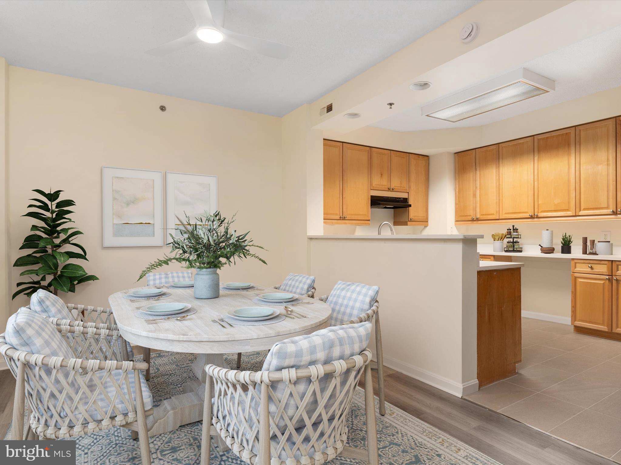 940 Astern Way, Unit 604 Annapolis, MD 21401 - Photo 10 of 27 a kitchen with granite countertop sink table and chairs