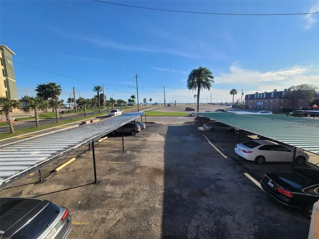 a view of a swimming pool with a table and chairs