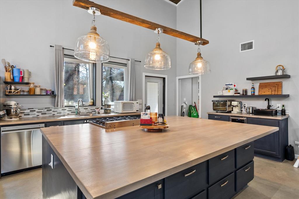 230 Fcr, Unit 540 Fairfield, TX 75840 - Photo 14 of 37 a kitchen with sink and chairs