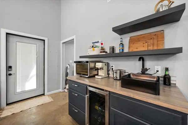 a kitchen with stainless steel appliances a sink and cabinets