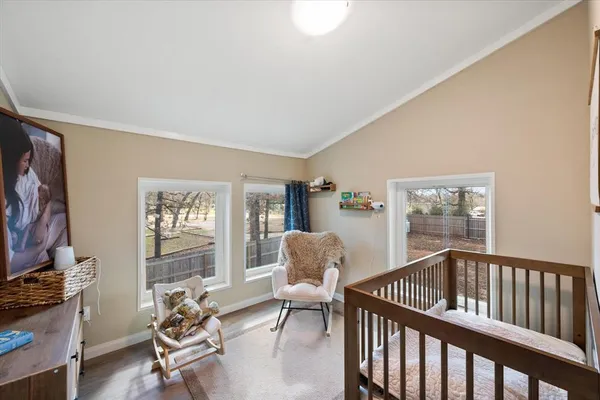 a bedroom with furniture and a window