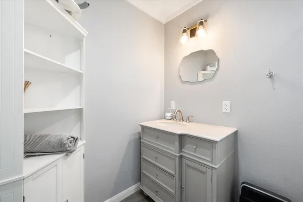 a bathroom with a sink and a mirror