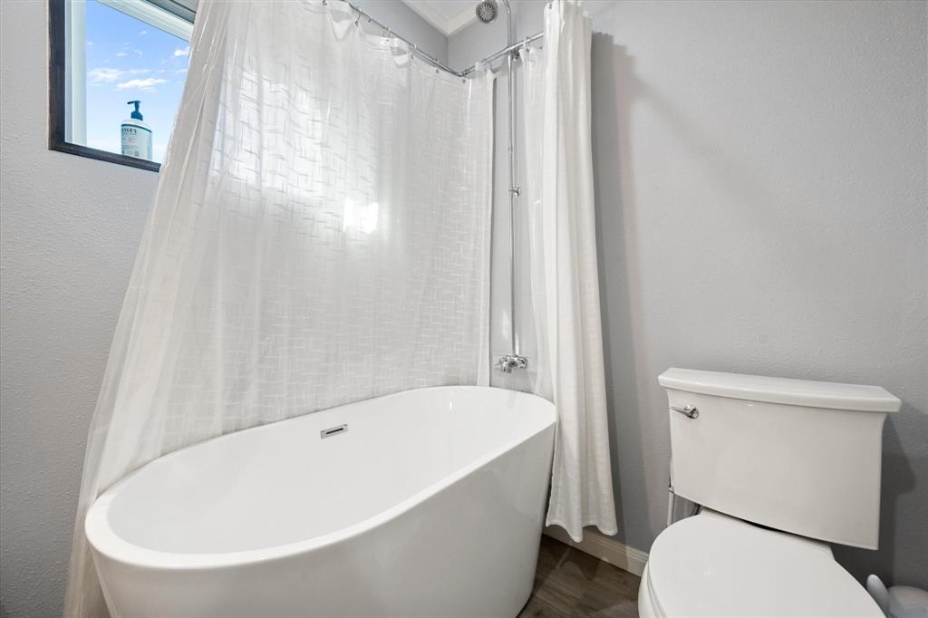 230 Fcr, Unit 540 Fairfield, TX 75840 - Photo 27 of 37 a white bath tub sitting next to a white toilet