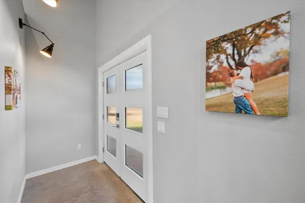 a view of an entryway with wooden floor
