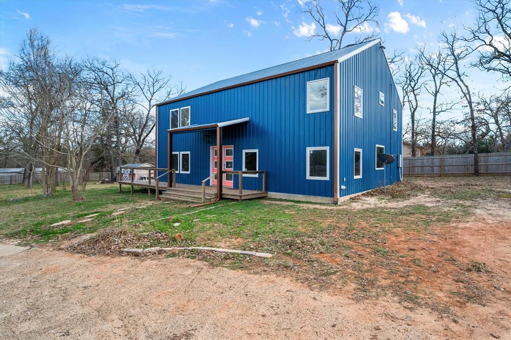 230 Fcr, Unit 540 Fairfield, TX 75840 - Photo 35 of 37 a view of a house with a yard and large tree