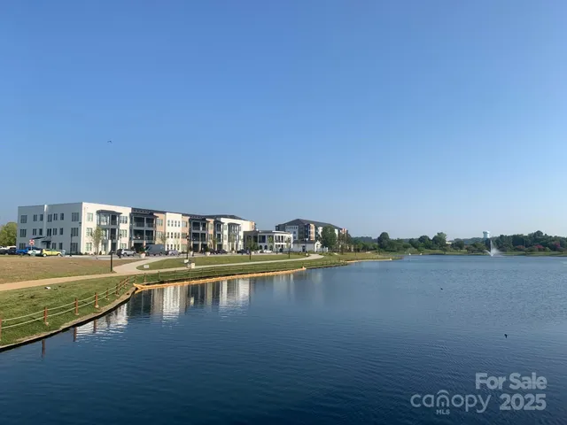 a view of a lake with building in front of it