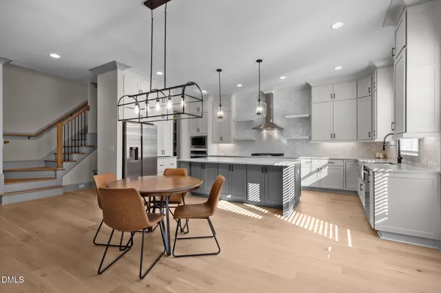 a kitchen with a sink dishwasher a stove and a refrigerator