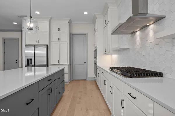 a kitchen with cabinets and window