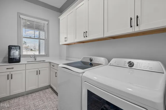 a spacious bedroom with a bed and a window