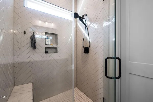 a bathroom with a toilet a sink and a mirror