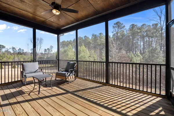 a view of a balcony with furniture