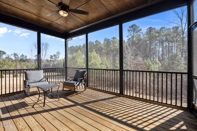 a view of a balcony with furniture