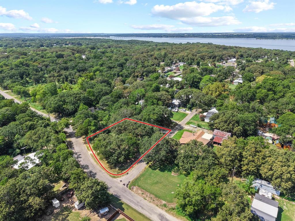 29 Allen A Dale Gordonville, TX 76245 - Photo 12 of 25 an aerial view of residential houses with outdoor space and trees