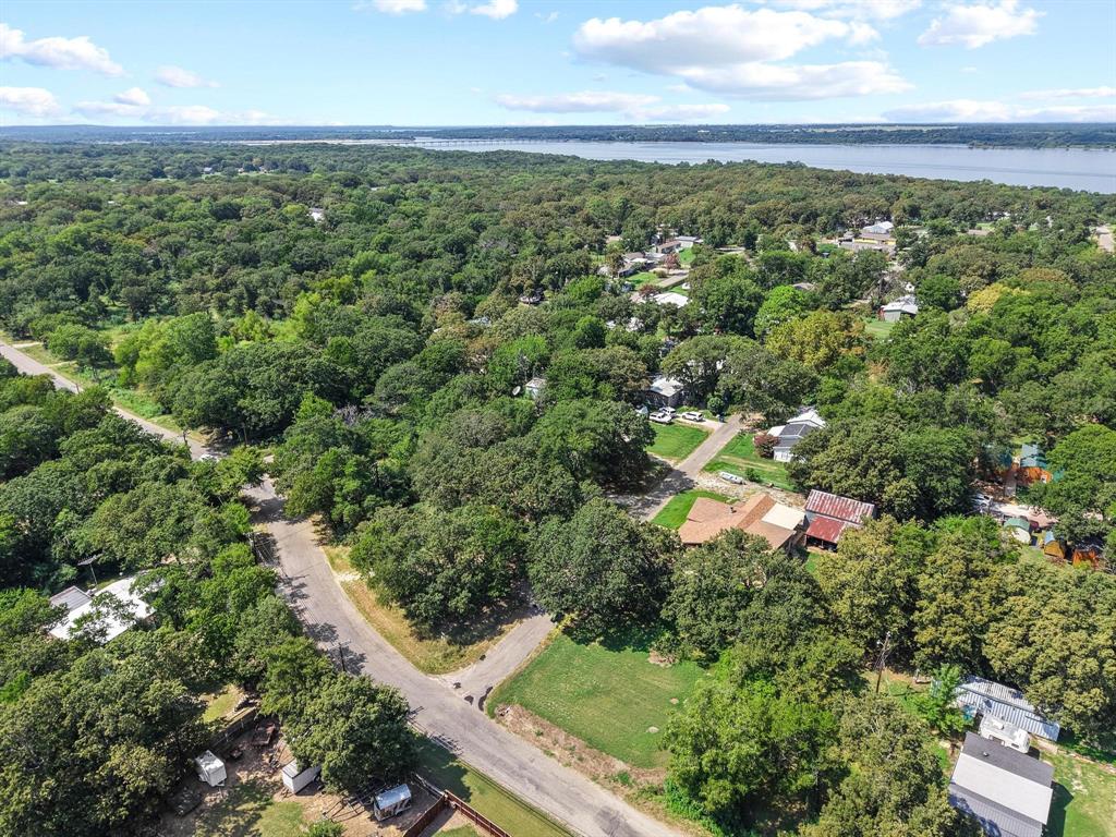 29 Allen A Dale Gordonville, TX 76245 - Photo 24 of 25 an aerial view of residential houses with outdoor space and trees