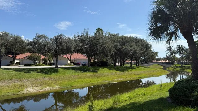 a view of yard with swimming pool and green space
