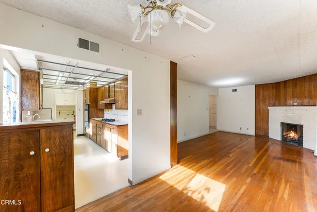 a kitchen with stainless steel appliances a stove a sink and a refrigerator