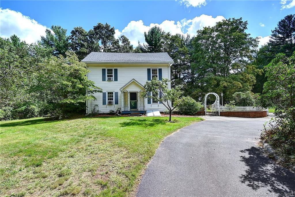 62 Church Street Vernon, CT 06066 - Photo 1 of 1 a front view of a house with yard and green space