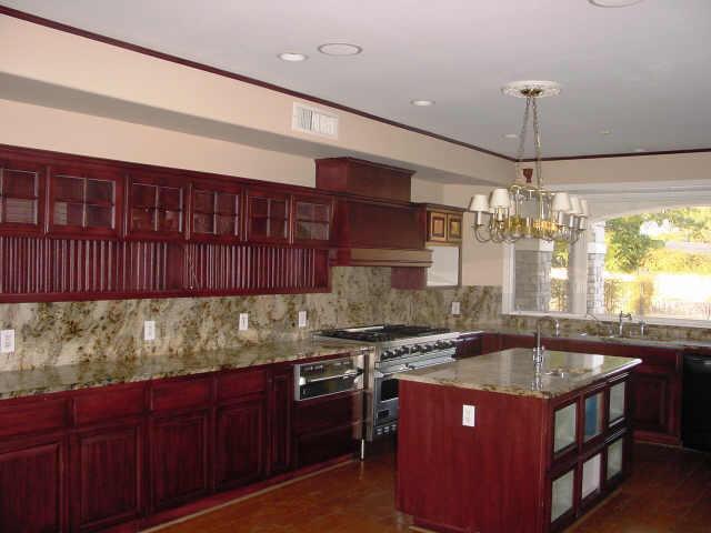 754 East Carver Road Tempe, AZ 85284 - Photo 4 of 6 a kitchen with stainless steel appliances granite countertop a sink stove and cabinets