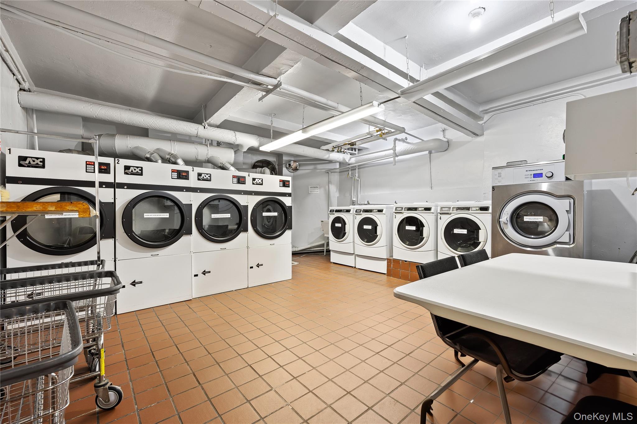35-35 75th Street, Unit 324 Queens, NY 11372 - Photo 16 of 22 a utility room with dryer and washer