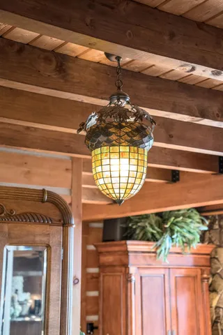 a view of a dining room with furniture wooden floor and chandelier