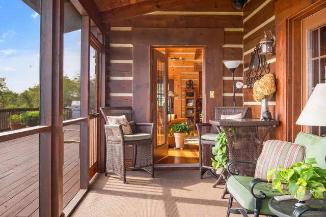 a view of balcony with wooden floor