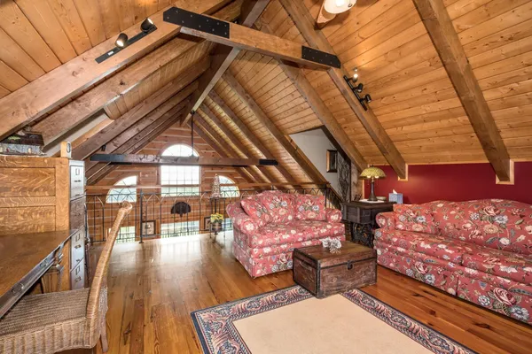 a bedroom with a bed dresser and a flat screen tv