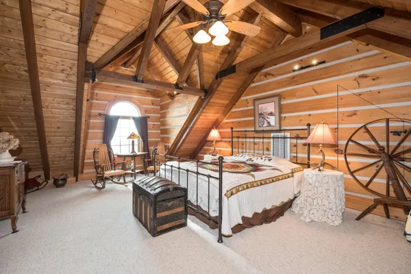 a room with pool table and windows