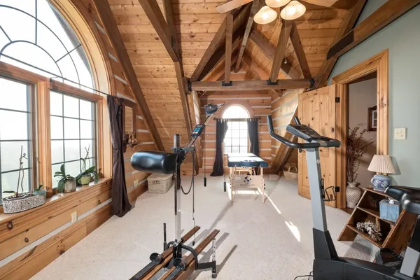 a room with a table chairs and entryway