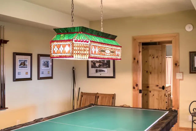 a front view of a house with a yard table and chairs