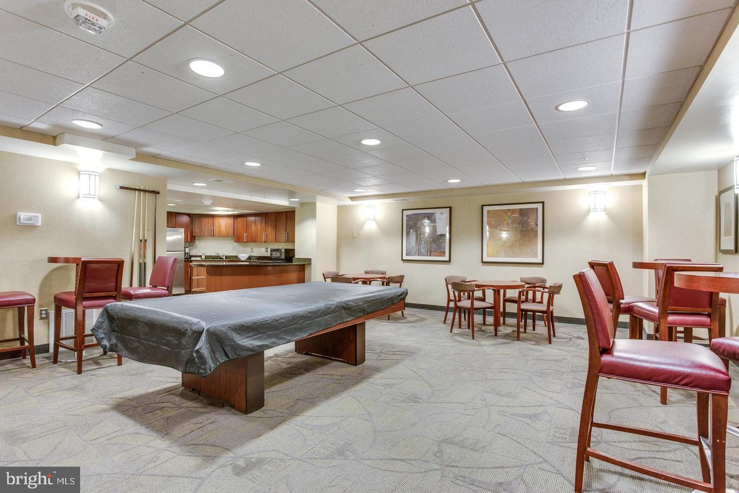 7915 Eastern Avenue Northwest, Unit 1114 Silver Spring, MD 20910 - Photo 24 of 34 a room with furniture pool table and flat screen tv