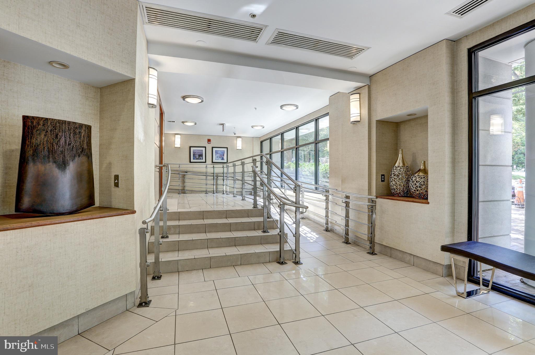 7915 Eastern Avenue Northwest, Unit 1114 Silver Spring, MD 20910 - Photo 4 of 34 a view of an entryway with wooden floor and a rug