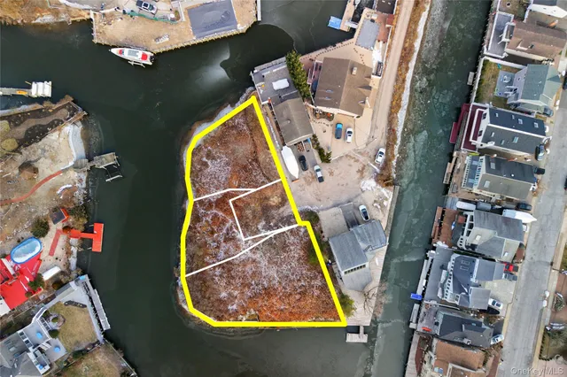 an aerial view of multi story residential apartment building with yard