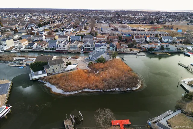 an aerial view of a house with a lake view