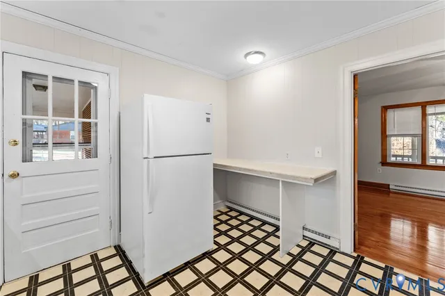a view of an entryway with wooden floor