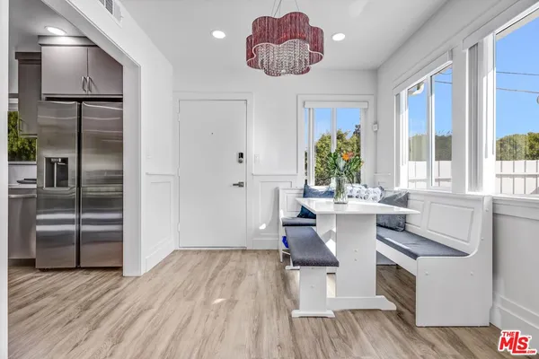 a kitchen with a sink appliances and cabinets