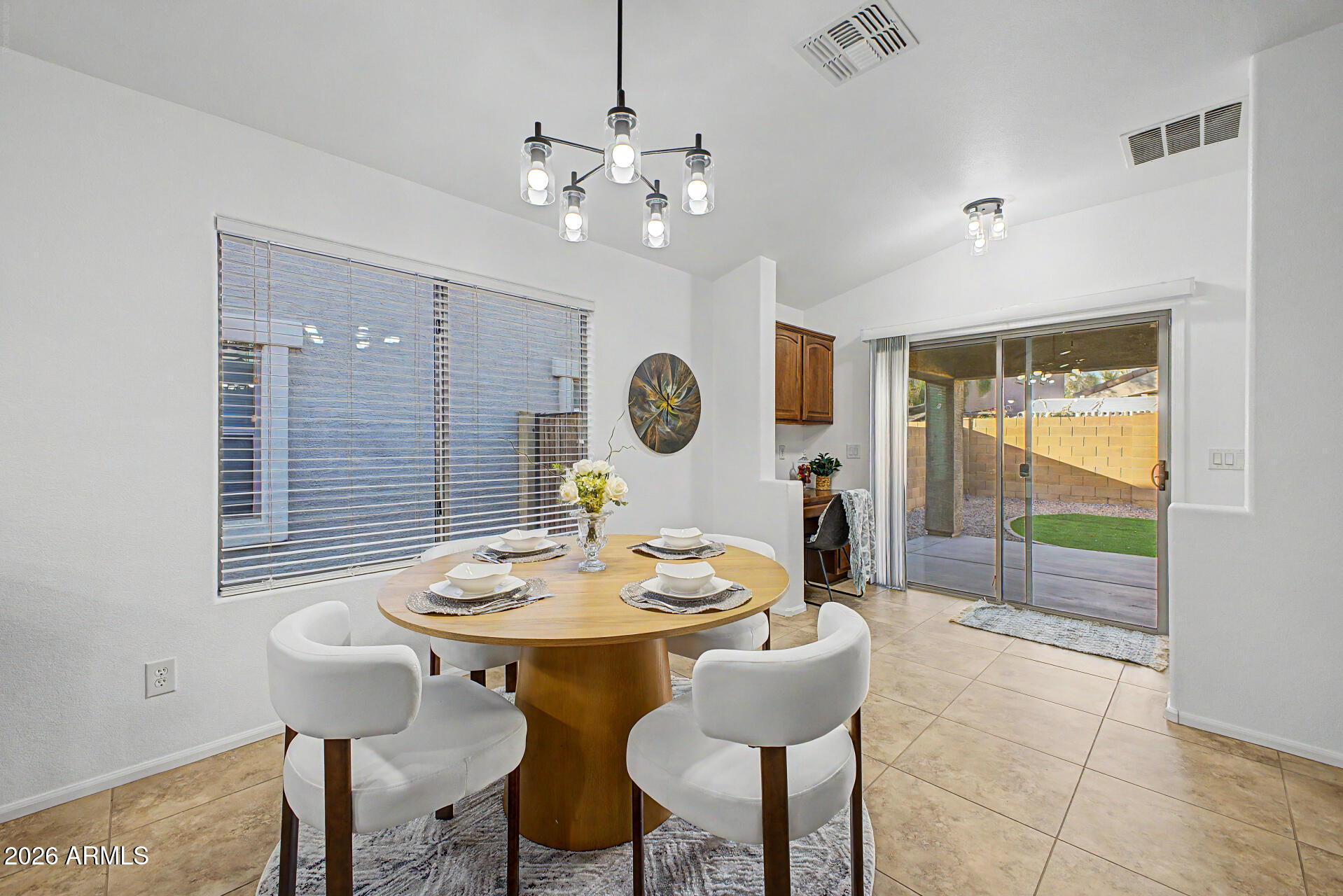 4168 East Sandy Way Gilbert, AZ 85297 - Photo 6 of 47 a view of a dining room with furniture and chandelier